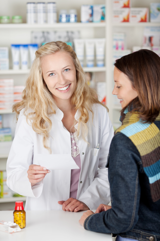 woman pharmacist assisting customer