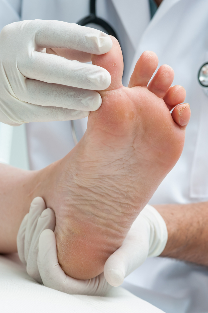 doctor examining foot
